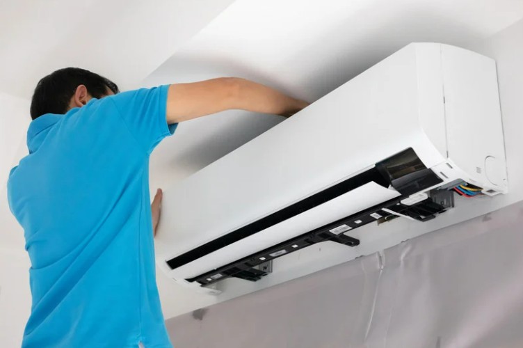 Man installing air conditioning